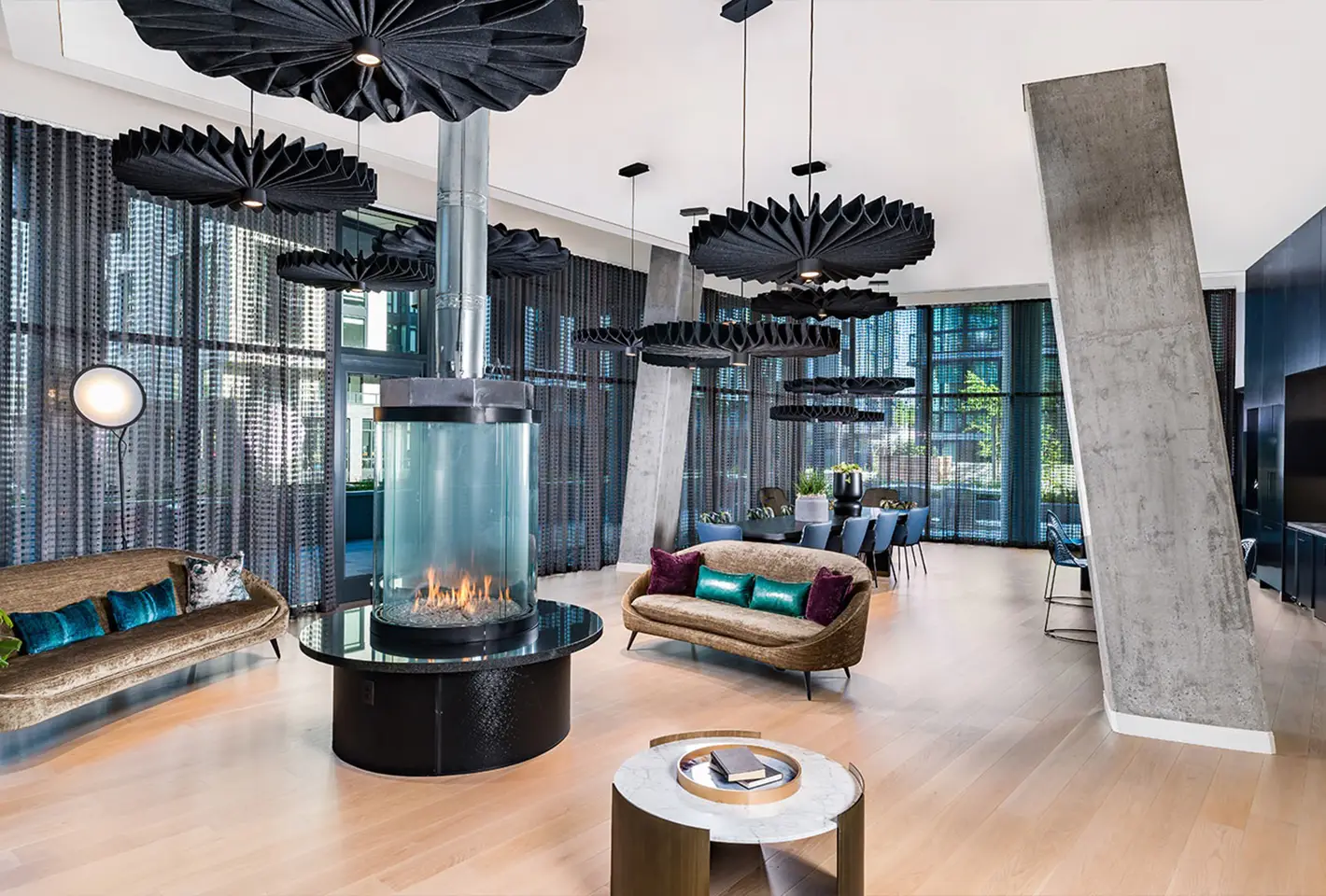 Stylish rooftop lounge featuring bold furniture, fireplace, and modern design