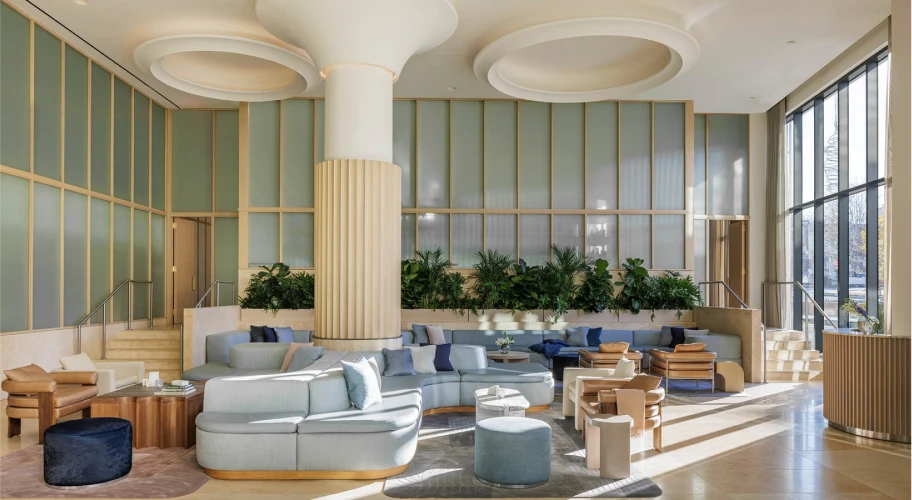Stylish lobby area featuring modern decor, comfortable seating, and floor-to-ceiling windows