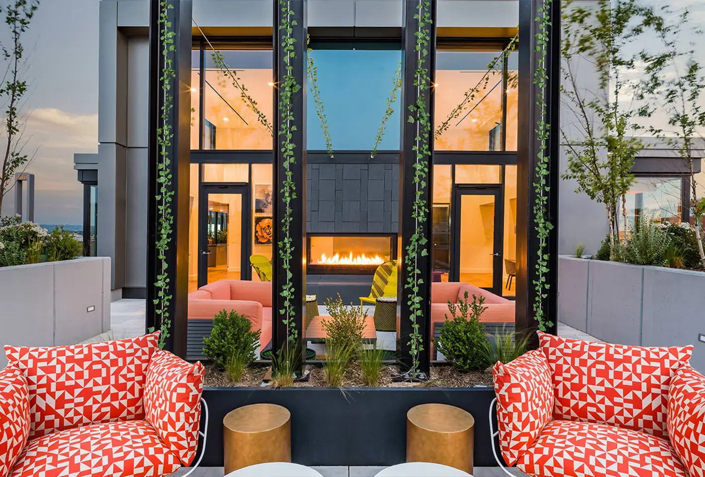 Vibrant outdoor terrace with cozy seating and lush greenery for a serene atmosphere