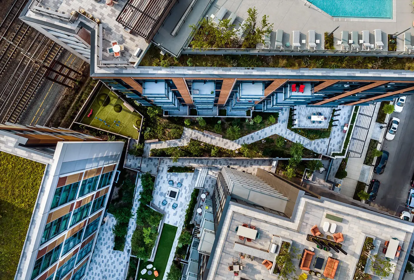 Overhead shot of landscaped pathways and outdoor spaces between modern buildings