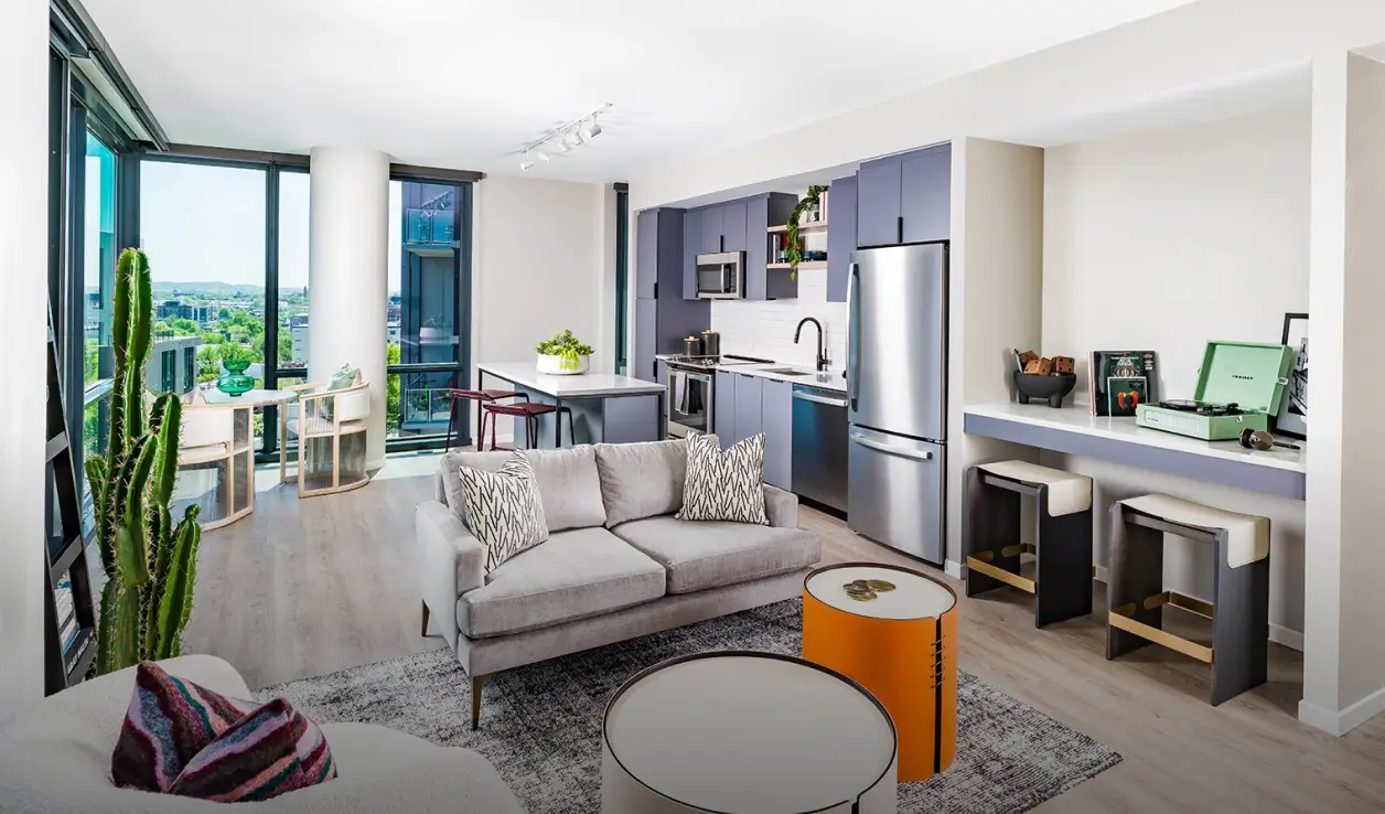 Bright and modern apartment interior featuring cozy furniture, contemporary kitchen, and large windows