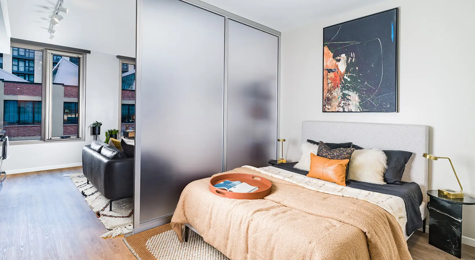 Compact bedroom area blending functionality and style in an open floor plan