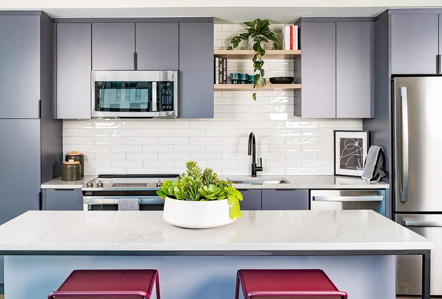 Contemporary apartment kitchen featuring high-end fixtures and functional, elegant design