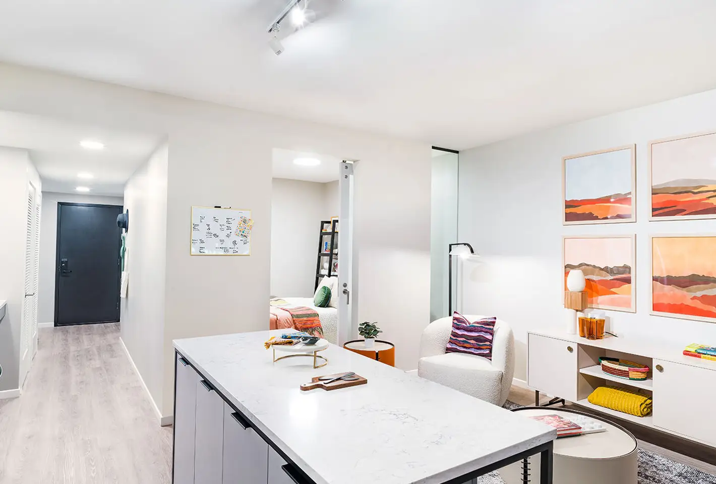 Sophisticated study area with warm tones, natural light, and colorful artwork on walls